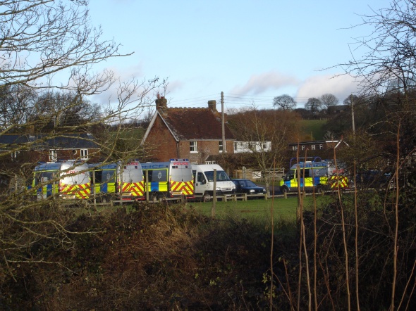 Police vans in the recreation ground car park in Crowhurst (21/12/12)